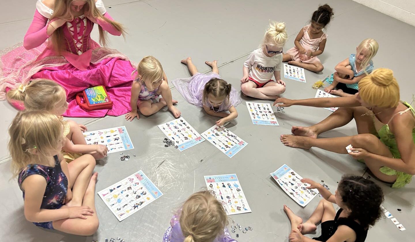 Children play games at the dance studio with skilled instructors dressed in costume