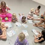 Children play games at the dance studio with skilled instructors dressed in costume
