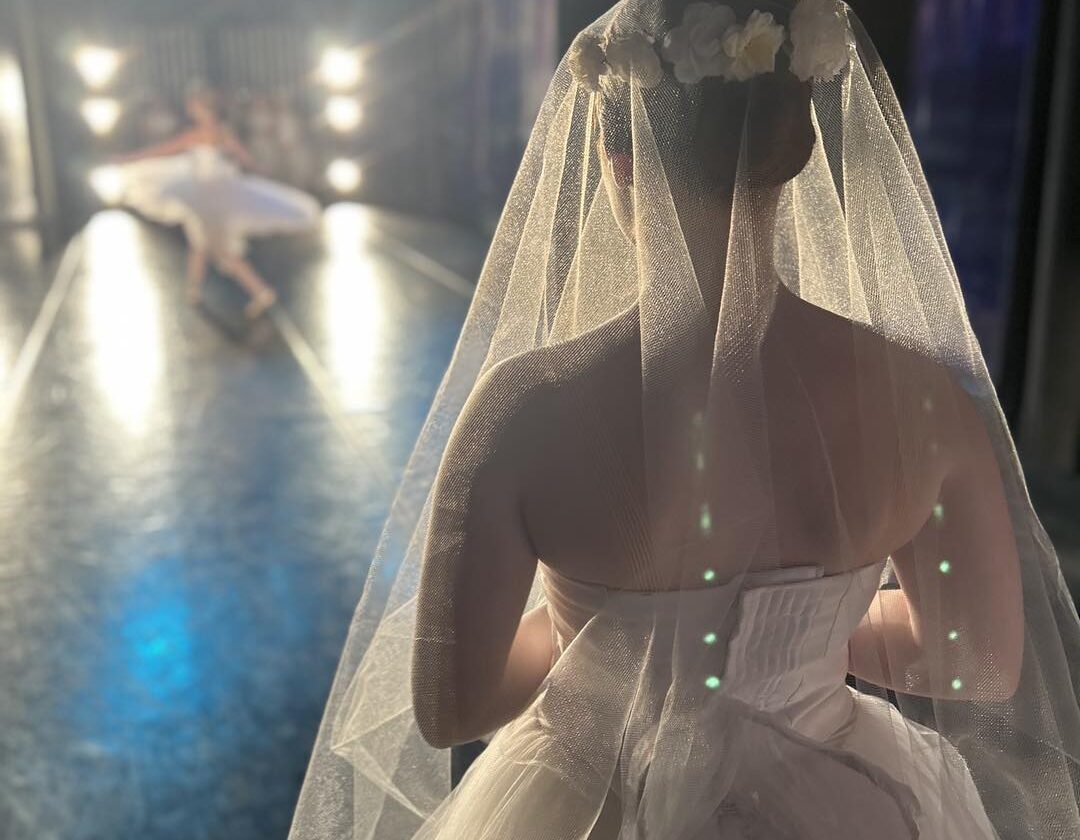 Ballet dancer waits in the wings for her moment
